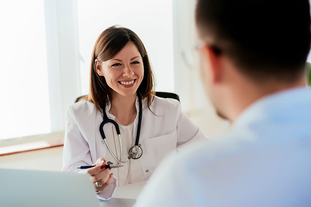 Female doctor speaking with patient