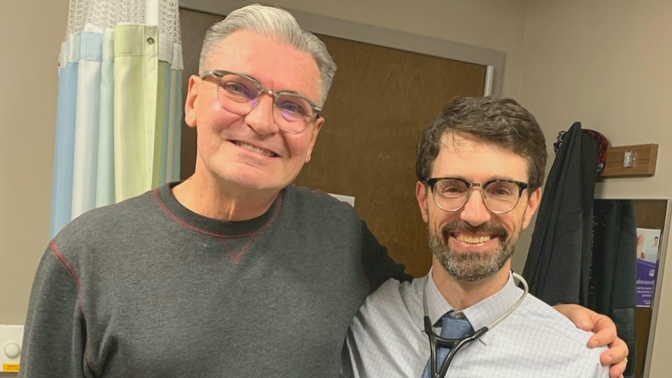 Will with his arm around Dr. Mackler