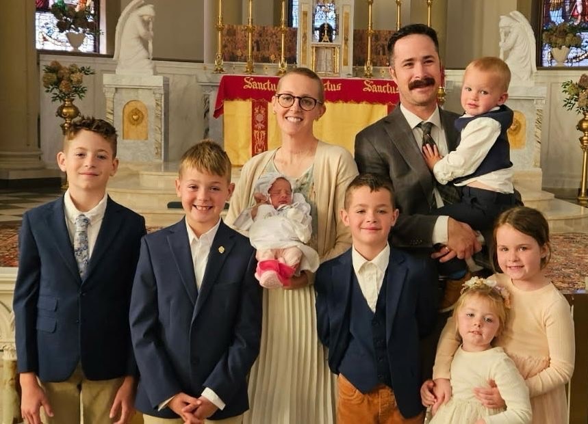 The entire Dubravec family at Gianna’s christening: Kellie and husband Nate, Gabriel (10), Michael (9), John (7), Margaret (5), Philomena (4), Emil (2), Gianna