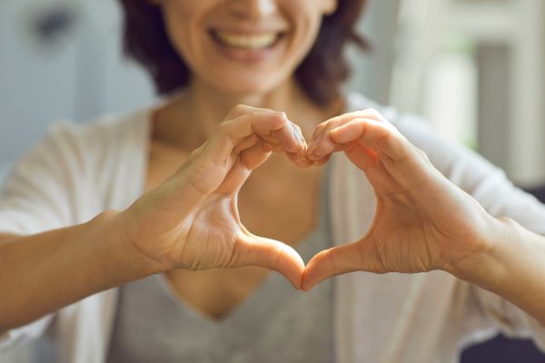 Woman making a heart symbol with her hands