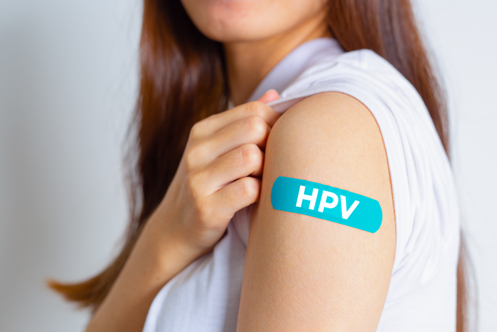 Bandaid saying HPV on Woman's Arm