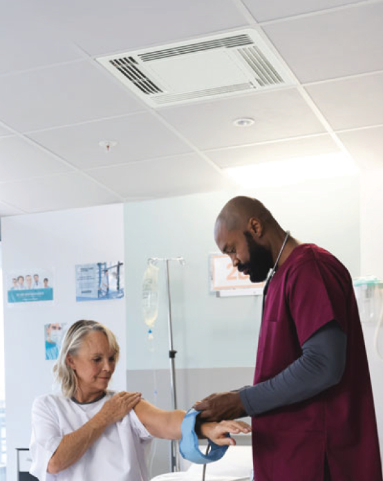 Patient and caregiver in hospital room