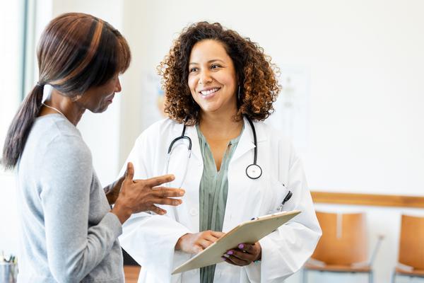female patient speaking with primary care provider