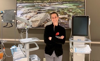 Raegan Lockhart in a work setting with equipment nearby